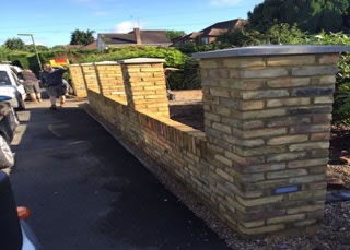 A new front garden wall constructed and fitted with low lighting in Egham.